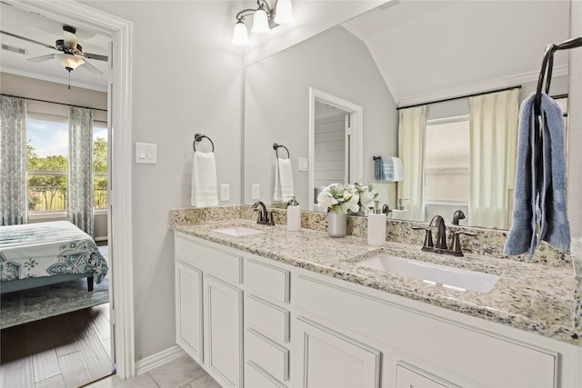 bathroom featuring ceiling fan, vanity, lofted ceiling, wood-type flooring, and crown molding