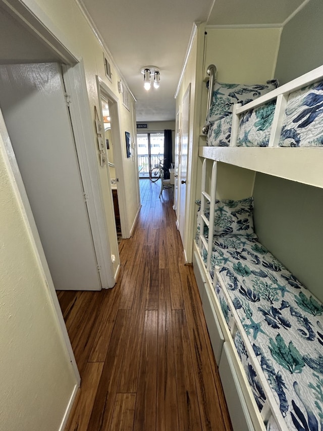 6102 Seawall Blvd Unit 375, Galveston, TX 77551 - corridor featuring dark wood-style floors and baseboards