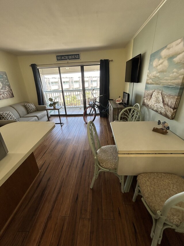 6102 Seawall Blvd Unit 375, Galveston, TX 77551 - dining room with dark wood-type flooring