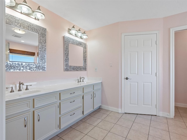 full bathroom with visible vents, tile patterned flooring, double vanity, and a sink