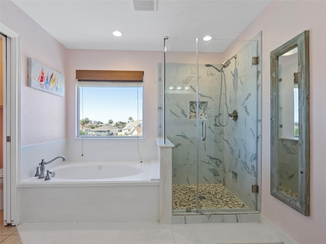 full bathroom featuring tile patterned flooring, a bath, a marble finish shower, and visible vents