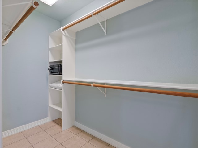 spacious closet featuring light tile patterned floors