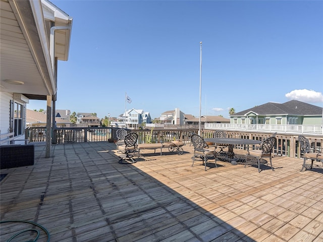 view of patio featuring a wooden deck, a residential view, and central air condition unit