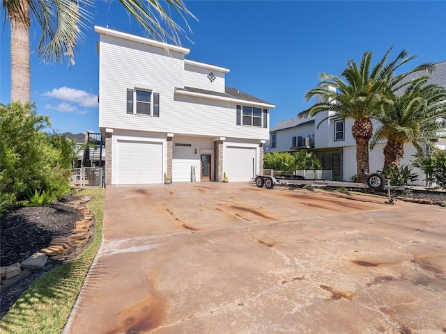 view of front of home featuring concrete driveway and a garage