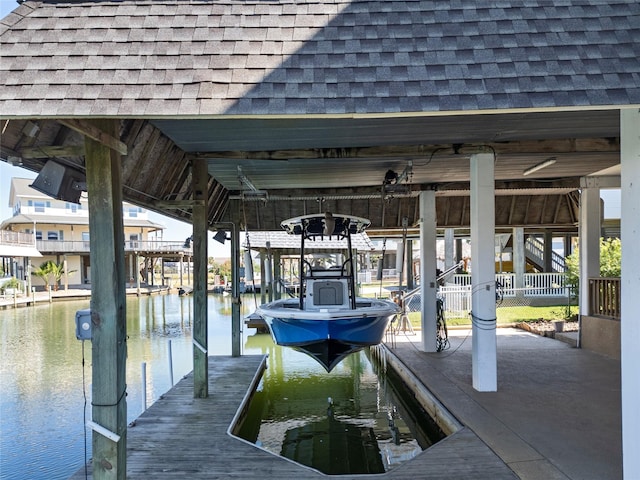 dock area featuring a water view and boat lift
