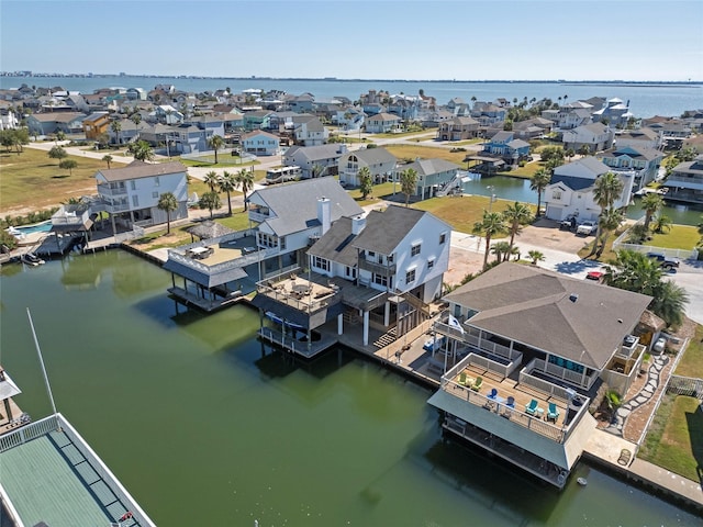 aerial view with a residential view and a water view