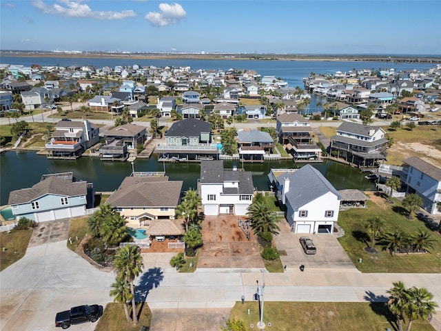 birds eye view of property featuring a water view and a residential view
