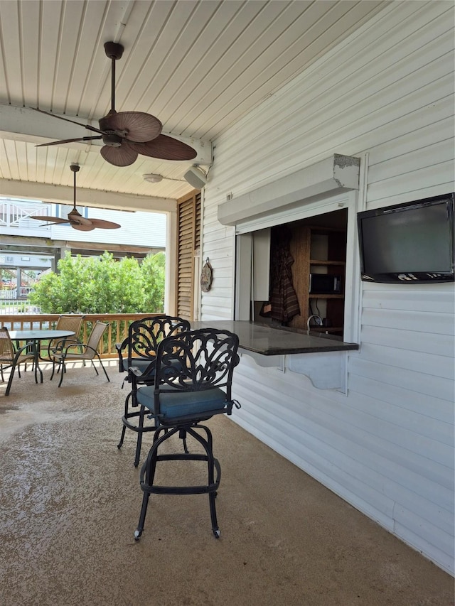 view of patio / terrace with outdoor dining area and ceiling fan