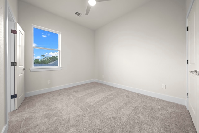 unfurnished room featuring light carpet and ceiling fan