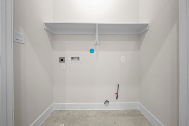 laundry area featuring light tile patterned floors, electric dryer hookup, washer hookup, and gas dryer hookup