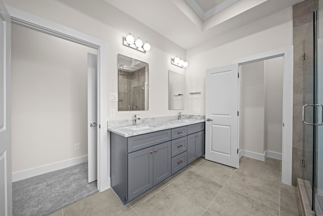 bathroom featuring vanity, tile patterned floors, and walk in shower