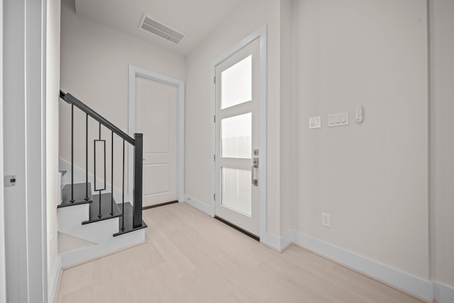 entrance foyer with light hardwood / wood-style floors