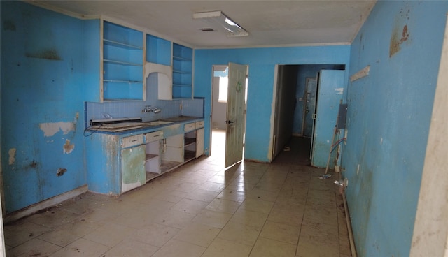 kitchen with blue cabinets and crown molding