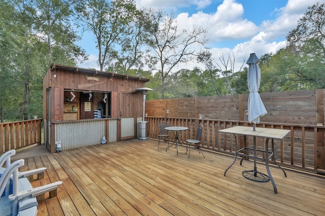 wooden deck with an outdoor structure