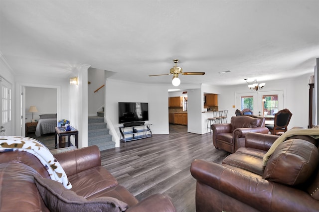 living room featuring ceiling fan with notable chandelier, hardwood / wood-style flooring, french doors, and crown molding