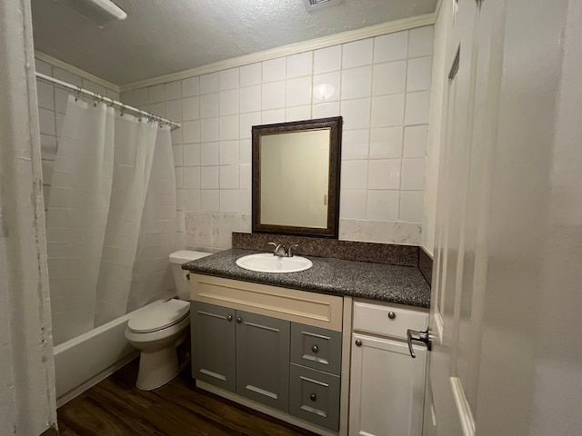 full bathroom featuring vanity, hardwood / wood-style flooring, shower / tub combo with curtain, ornamental molding, and toilet