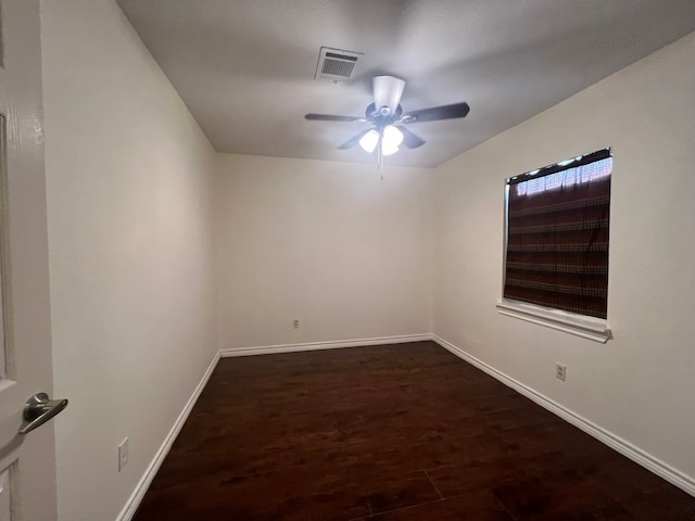 unfurnished room featuring dark hardwood / wood-style flooring and ceiling fan