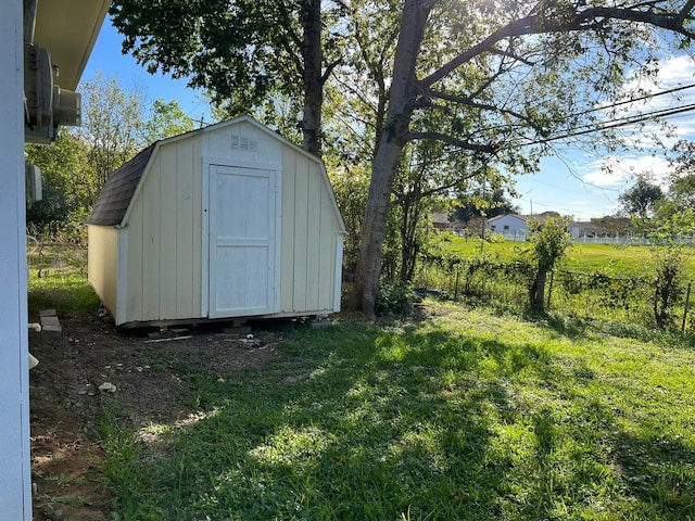 view of shed with fence