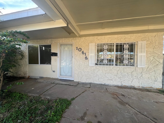 doorway to property with a patio area