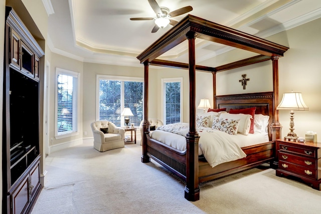 bedroom with ceiling fan, ornamental molding, and light carpet