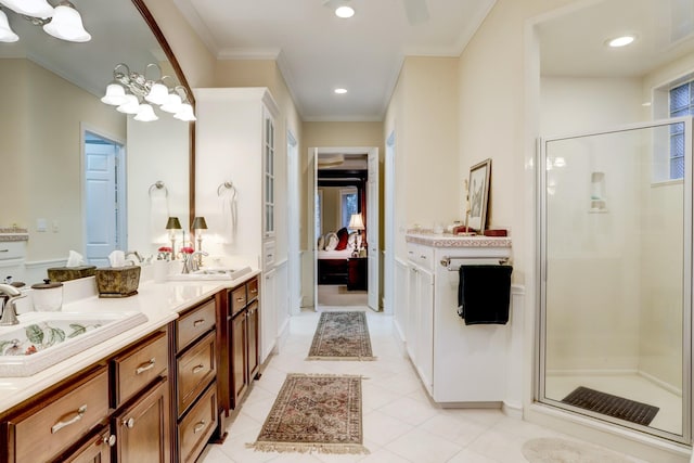 bathroom featuring a notable chandelier, tile patterned floors, an enclosed shower, vanity, and ornamental molding