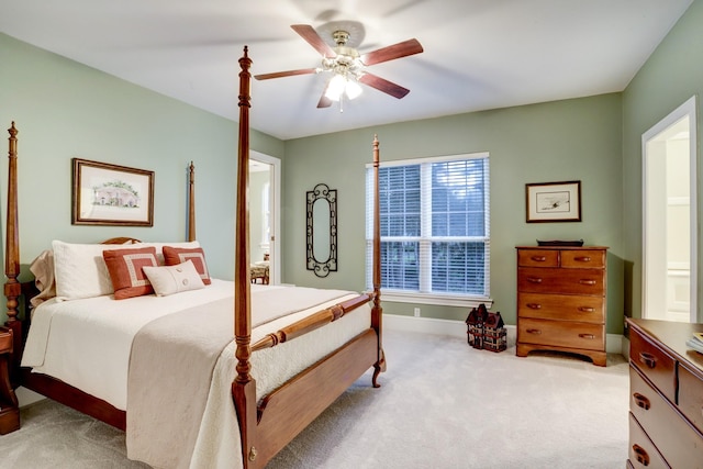 bedroom with ceiling fan and light colored carpet