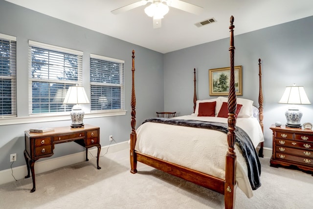 bedroom with ceiling fan and light colored carpet