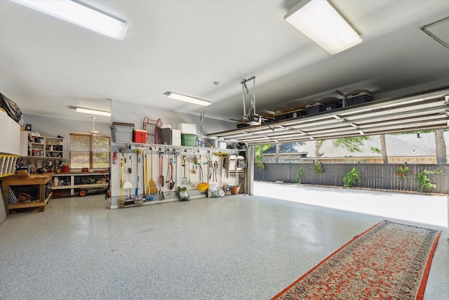 garage featuring a workshop area and a garage door opener