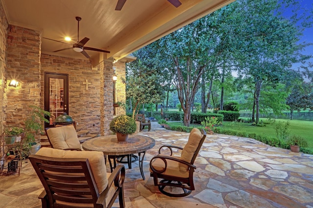 view of patio / terrace featuring ceiling fan