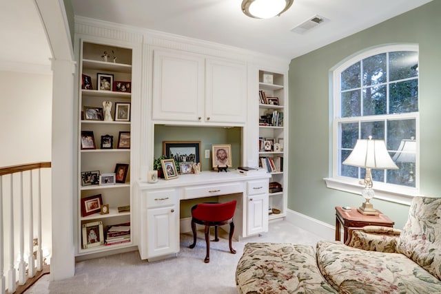 carpeted office with built in desk