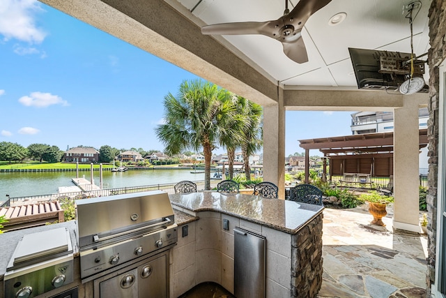 view of patio / terrace with grilling area, a water view, and area for grilling