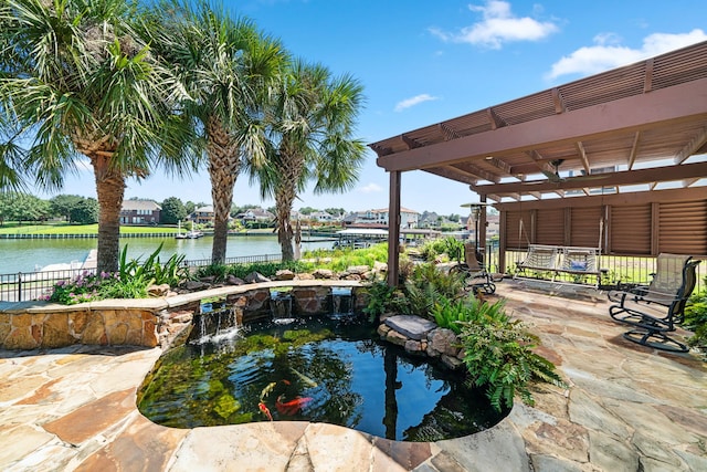 view of patio with a water view