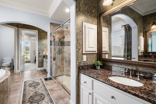 full bathroom featuring ornamental molding, vanity, toilet, and plus walk in shower