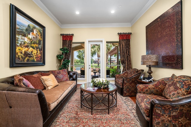 living room with ornamental molding and hardwood / wood-style floors