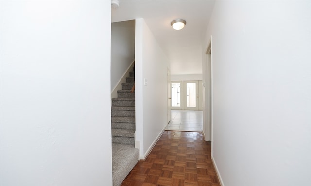 hallway with dark parquet floors