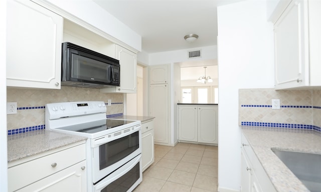 kitchen featuring decorative backsplash, white electric range oven, white cabinets, and an inviting chandelier