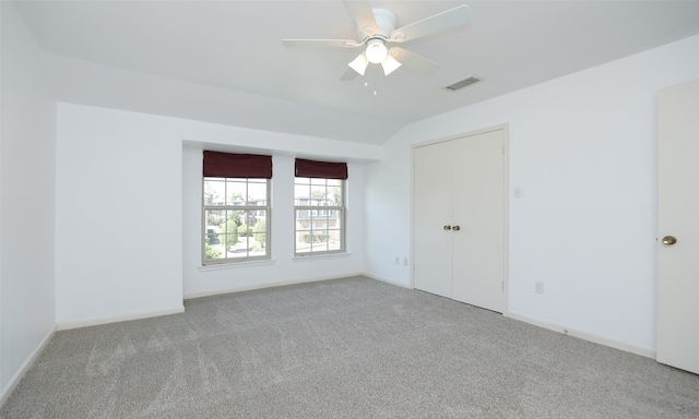 spare room with light carpet and ceiling fan