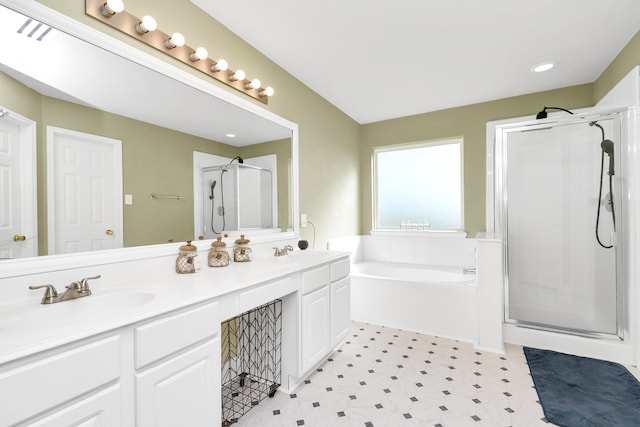 bathroom featuring vanity and separate shower and tub