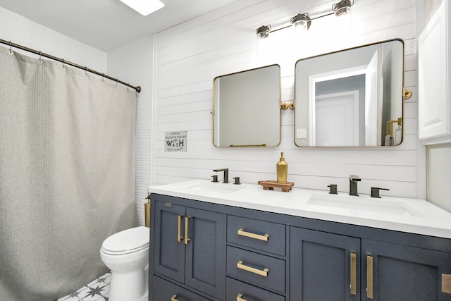 bathroom with wood walls, curtained shower, vanity, and toilet