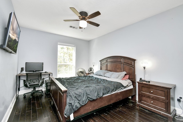 bedroom with ceiling fan and dark hardwood / wood-style floors