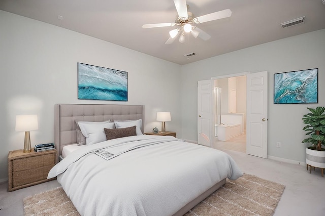 carpeted bedroom featuring ceiling fan and connected bathroom