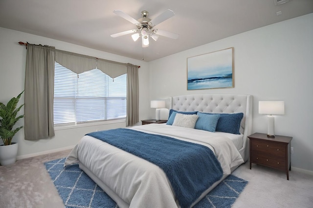 bedroom with ceiling fan and light colored carpet