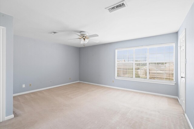 600 Wilcrest Dr Unit 8, Houston, TX 77042 - unfurnished room featuring light carpet, a ceiling fan, and baseboards