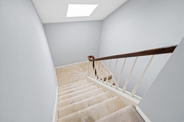 600 Wilcrest Dr Unit 8, Houston, TX 77042 - staircase with a skylight, carpet floors, and baseboards
