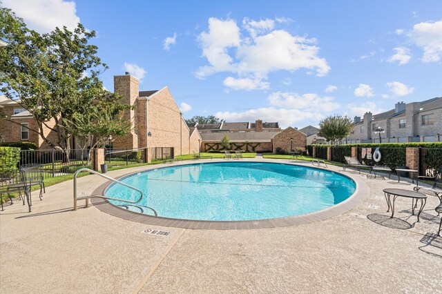 600 Wilcrest Dr Unit 8, Houston, TX 77042 - community pool featuring a residential view, fence, and a patio area
