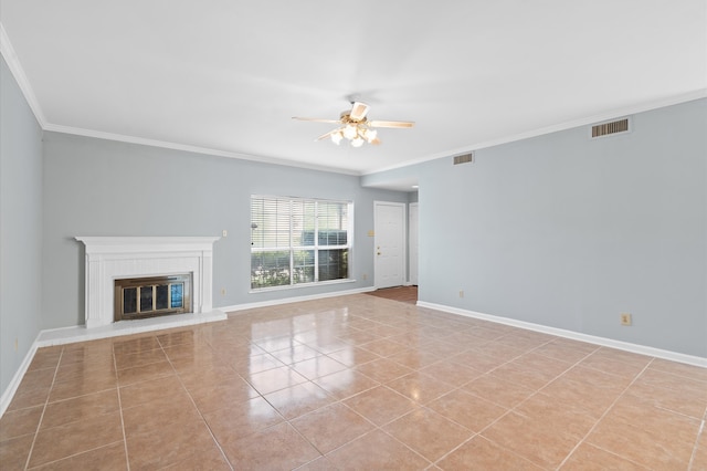 unfurnished living room with ceiling fan, light tile patterned floors, and ornamental molding