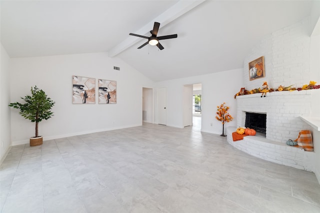 unfurnished living room with ceiling fan, a fireplace, and lofted ceiling with beams