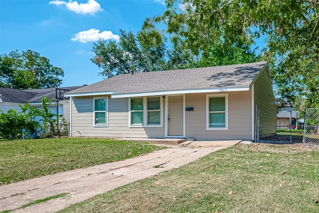 single story home featuring a front yard