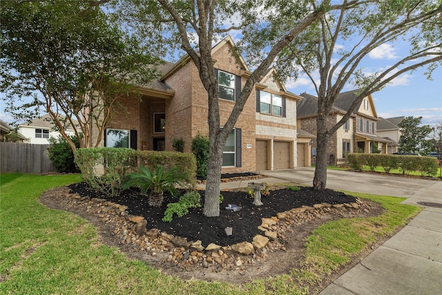 view of front of house featuring a garage and a front lawn