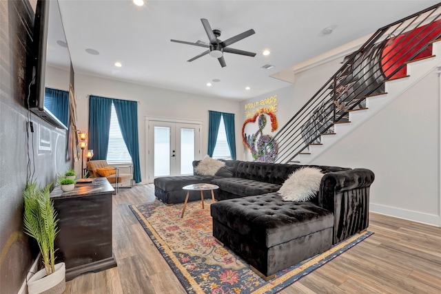 living room featuring french doors, ceiling fan, and hardwood / wood-style floors